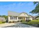 Well-maintained home featuring a spacious driveway, lush green lawn, and charming front porch at 5018 Drake Pond Ln, Rock Hill, SC 29732