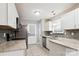 Well-lit kitchen featuring stainless steel appliances, granite countertops, and tiled backsplash at 5018 Drake Pond Ln, Rock Hill, SC 29732