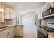 Bright kitchen showcasing stainless steel appliances, stone backsplash, and modern countertops at 5018 Drake Pond Ln, Rock Hill, SC 29732