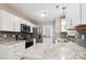 Close-up of a kitchen with granite countertops, stainless steel appliances, and a tile backsplash at 5018 Drake Pond Ln, Rock Hill, SC 29732