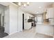 Bright kitchen with white cabinets, stainless steel appliances, granite countertops, and tile flooring at 5018 Drake Pond Ln, Rock Hill, SC 29732