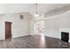Spacious living room with vaulted ceiling, hardwood flooring, and a cozy fireplace at 5018 Drake Pond Ln, Rock Hill, SC 29732