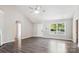 Bright living room boasts a large window, hardwood flooring, and vaulted ceiling at 5018 Drake Pond Ln, Rock Hill, SC 29732