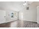 Comfortable living room with natural light, hardwood flooring, and a ceiling fan at 5018 Drake Pond Ln, Rock Hill, SC 29732
