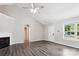 Spacious living room with a fireplace, vaulted ceilings, wood floors, and a bright window at 5018 Drake Pond Ln, Rock Hill, SC 29732