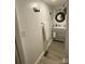 Bathroom with a gray vanity, decorative mirror and fresh white towels at 642 Boger St, Mooresville, NC 28115