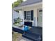 Inviting front porch with a relaxing swing, decorative touches, and a welcoming atmosphere at 642 Boger St, Mooresville, NC 28115
