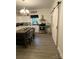 Modern kitchen with a large island, stainless steel appliances, and a stylish chandelier for a sophisticated look at 642 Boger St, Mooresville, NC 28115