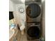 A compact laundry area features a stacked washer and dryer for space-saving convenience at 642 Boger St, Mooresville, NC 28115
