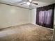 Bedroom with neutral walls, carpeted flooring, and a window with blinds, creating a simple and functional space at 668 Osteen Rd, York, SC 29745