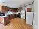 Functional kitchen with stainless steel appliances, wood cabinets, and ample countertop space for cooking at 668 Osteen Rd, York, SC 29745