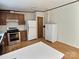 A kitchen features wooden cabinets, stainless steel appliances, and vinyl flooring with ample space at 668 Osteen Rd, York, SC 29745