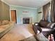 Inviting living room with a brick fireplace, neutral-toned walls, and a comfortable seating area at 668 Osteen Rd, York, SC 29745