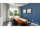 Stylish dining room with a modern table, seating for six, natural light, and attractive wall decor at 733 Wagon Cross Ct, York, SC 29745