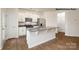 Bright kitchen with granite island, stainless steel appliances, and ample counter space at 739 Wagon Cross Ct, York, SC 29745