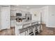 Modern kitchen features stainless steel appliances, granite countertops, and center island with seating at 739 Wagon Cross Ct, York, SC 29745