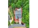 Aerial view of a well-maintained home with landscaped front yard, spacious driveway and mature trees at 7710 Grove Hall Ave, Mint Hill, NC 28227