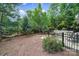 This large backyard offers mature trees, privacy and a hot tub perfect for quiet solitude at 7710 Grove Hall Ave, Mint Hill, NC 28227