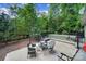 Landscaped backyard offers a private patio with a hot tub perfect for unwinding after a long day at 7710 Grove Hall Ave, Mint Hill, NC 28227