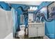 Bathroom featuring blue walls with painted black octopus design, vanity, toilet, and shower at 7710 Grove Hall Ave, Mint Hill, NC 28227