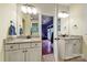 Modern bathroom with double vanities and granite countertops that connects to a bedroom at 7710 Grove Hall Ave, Mint Hill, NC 28227