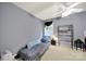 Simple bedroom with a comfortable daybed, natural light, and neutral-colored walls at 7710 Grove Hall Ave, Mint Hill, NC 28227