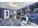 Bedroom featuring blue walls with eclectic decor, shelving, and a comfortable bed at 7710 Grove Hall Ave, Mint Hill, NC 28227