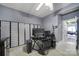 Bedroom features a ceiling fan, desk, and screen for privacy at 7710 Grove Hall Ave, Mint Hill, NC 28227
