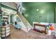 Welcoming two-story foyer with hardwood floors, staircase, and plenty of natural light at 7710 Grove Hall Ave, Mint Hill, NC 28227