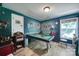 Eclectic game room featuring a pool table, decorative wallpaper, and vintage accents at 7710 Grove Hall Ave, Mint Hill, NC 28227
