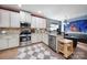 Well-equipped kitchen featuring stainless steel appliances, granite counters, and ample cabinet space at 7710 Grove Hall Ave, Mint Hill, NC 28227