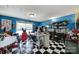 Bright kitchen has checkered floors, a stainless island, and a red refrigerator at 7710 Grove Hall Ave, Mint Hill, NC 28227