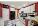 Well-equipped kitchen with stainless steel appliances, ample cabinet space, and a view into other living areas at 7710 Grove Hall Ave, Mint Hill, NC 28227