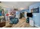 Comfortable living room with blue accent wall, wood floors, and unique decorative touches at 7710 Grove Hall Ave, Mint Hill, NC 28227