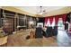 A comfortable living room with a fireplace, hardwood floors, and four recliner chairs at 7710 Grove Hall Ave, Mint Hill, NC 28227