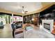 A spacious living room featuring a fireplace, decorative elements and hardwood floors at 7710 Grove Hall Ave, Mint Hill, NC 28227