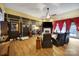 Spacious living room has dark walls, hard wood floors, and plush recliner seating at 7710 Grove Hall Ave, Mint Hill, NC 28227