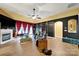 A bright living room with a fireplace, hardwood floors and an accent wall at 7710 Grove Hall Ave, Mint Hill, NC 28227