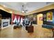 Comfortable living room with fireplace, red curtains, and theater seating at 7710 Grove Hall Ave, Mint Hill, NC 28227