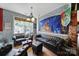 Cozy living room area with leather seating, large windows, and decorative lighting at 7710 Grove Hall Ave, Mint Hill, NC 28227