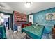 A unique room with green walls, wood floors, and a green table at 7710 Grove Hall Ave, Mint Hill, NC 28227
