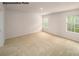 Spacious bedroom with carpet, light walls, and bright windows overlooking green space at 917 Two Brothers Ln, York, SC 29745