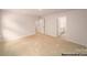 Large bedroom featuring neutral carpet and light walls with hallway and bathroom access at 917 Two Brothers Ln, York, SC 29745