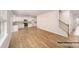 Spacious open floor plan with a kitchen featuring white cabinets, and a staircase at 917 Two Brothers Ln, York, SC 29745