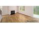 Bright living room with a fireplace, hardwood floors, and a sliding glass door to the backyard at 917 Two Brothers Ln, York, SC 29745