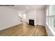 Living room featuring a fireplace, wood floors, staircase and lots of natural light at 917 Two Brothers Ln, York, SC 29745