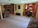 Finished basement area with a cozy seating area, built-in shelves, and a desk perfect for study or working from home at , Hickory, NC 28602