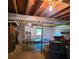 Unfinished basement showcasing exposed beams, water heater, and ample room for storage and activities with ping pong table at , Hickory, NC 28602