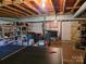 Unfinished basement offering plenty of storage space and potential for customization with ping pong table at , Hickory, NC 28602