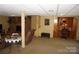 Spacious finished basement featuring a brick fireplace and built-in desk area perfect for a home office or study at , Hickory, NC 28602